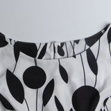 1950s White and Black Sleeveless Retro Polka Dot Belted Vintage Dress